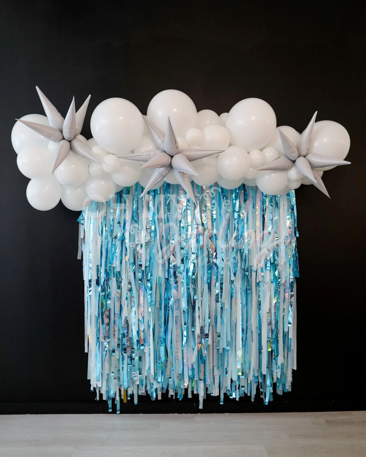 Blue, silver, and white fringe party backdrop and balloon garland by Oh My Darling Party Co