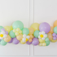 Hip Hop Balloon Kit fringe garland hanging against a white wall with balloons. Fringe decor perfect for corporate events or parties.