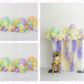 Hip Hop Balloon Kit fringe garland hanging against a white wall with balloons. Fringe decor perfect for corporate events or parties.