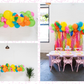 Beach Days Balloon Kit fringe garland hanging against a white wall with balloons. Fringe decor perfect for corporate events or parties.