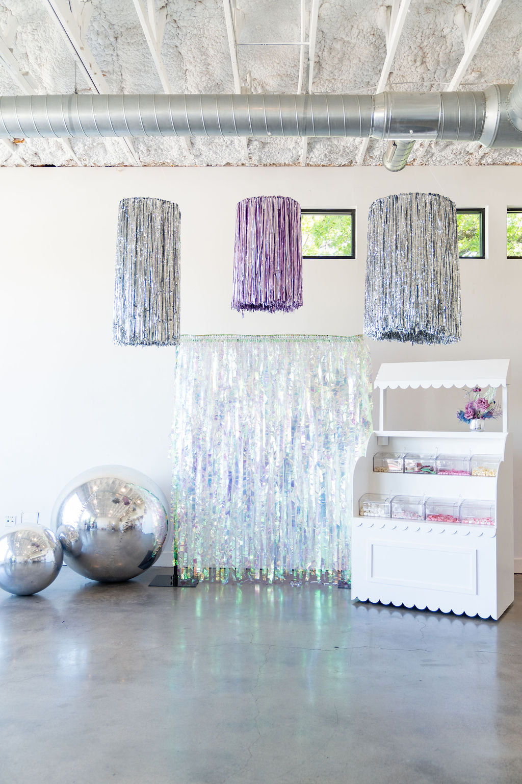 Handmade tinsel fringe ring styled overhead for a celebration