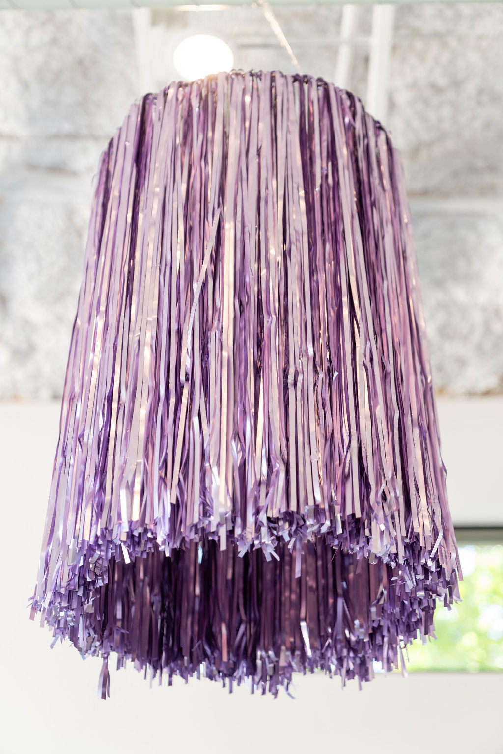 Tinsel aerial ring catching the light as disco party decor
