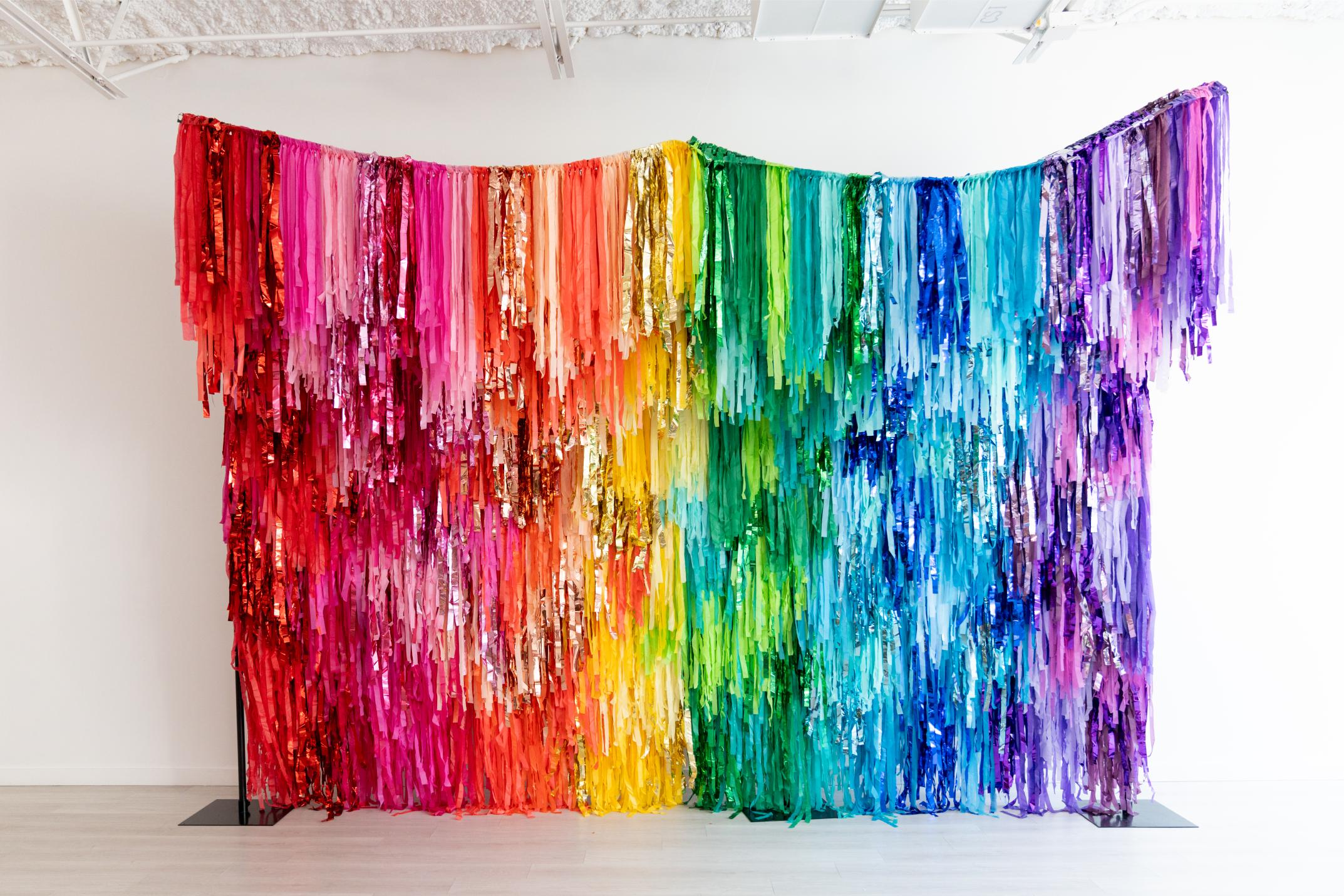 Rainbow fringe backdrop by Oh My Darling Party Co