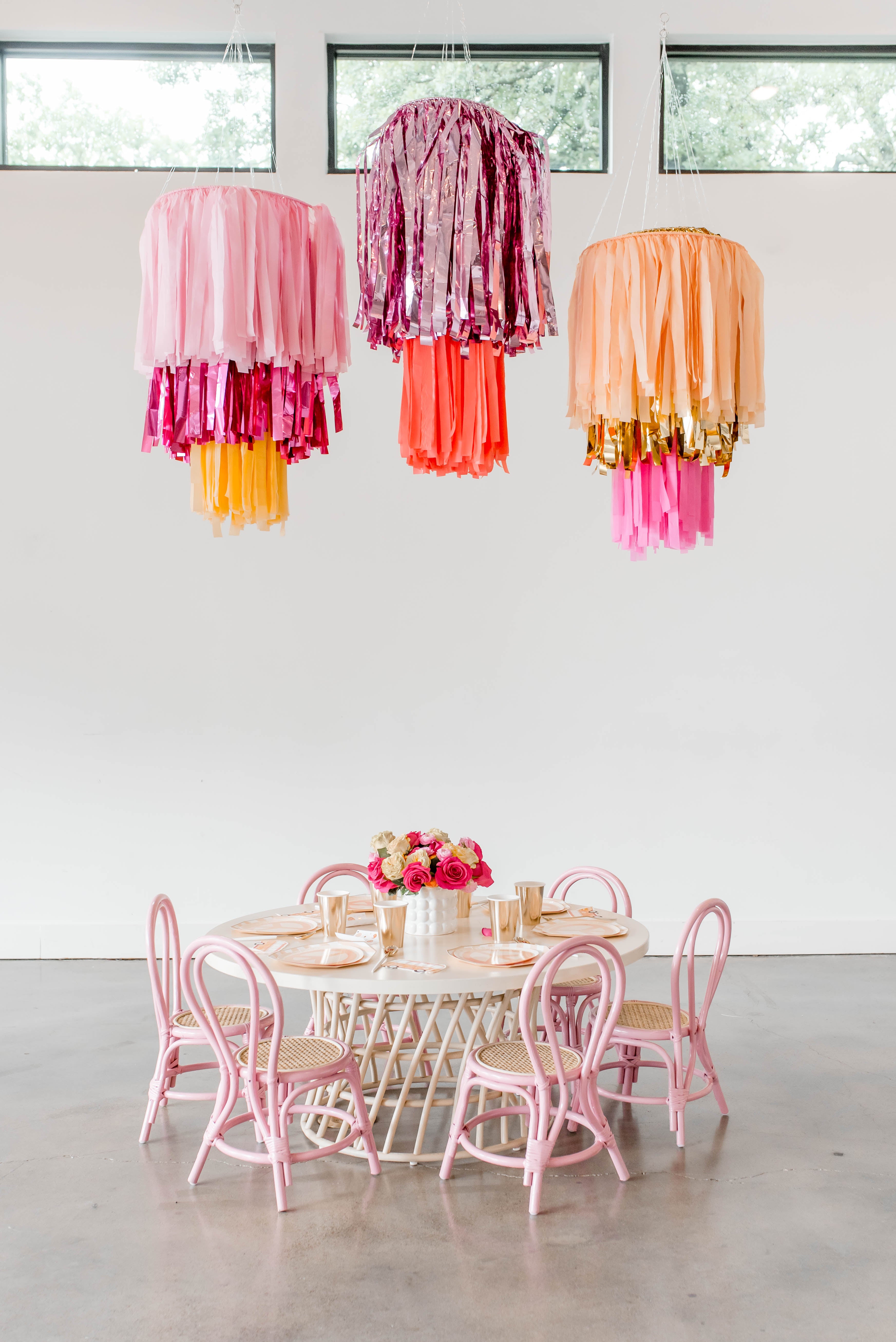 Tiered fringe ring chandelier with rings inside rings hanging from the ceiling