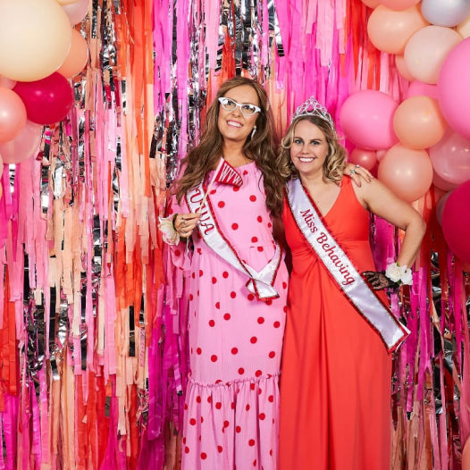 Oh my darling party co customer photo of pink and orange fringe backdrop