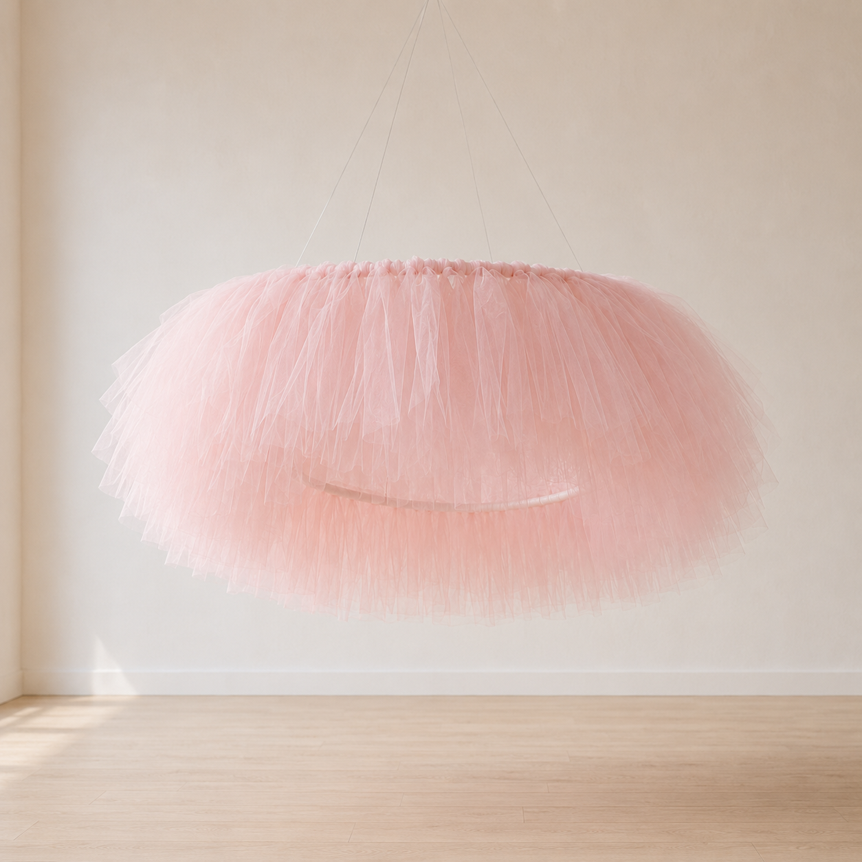 Handmade tulle aerial ring styled overhead for a baby shower or nursery