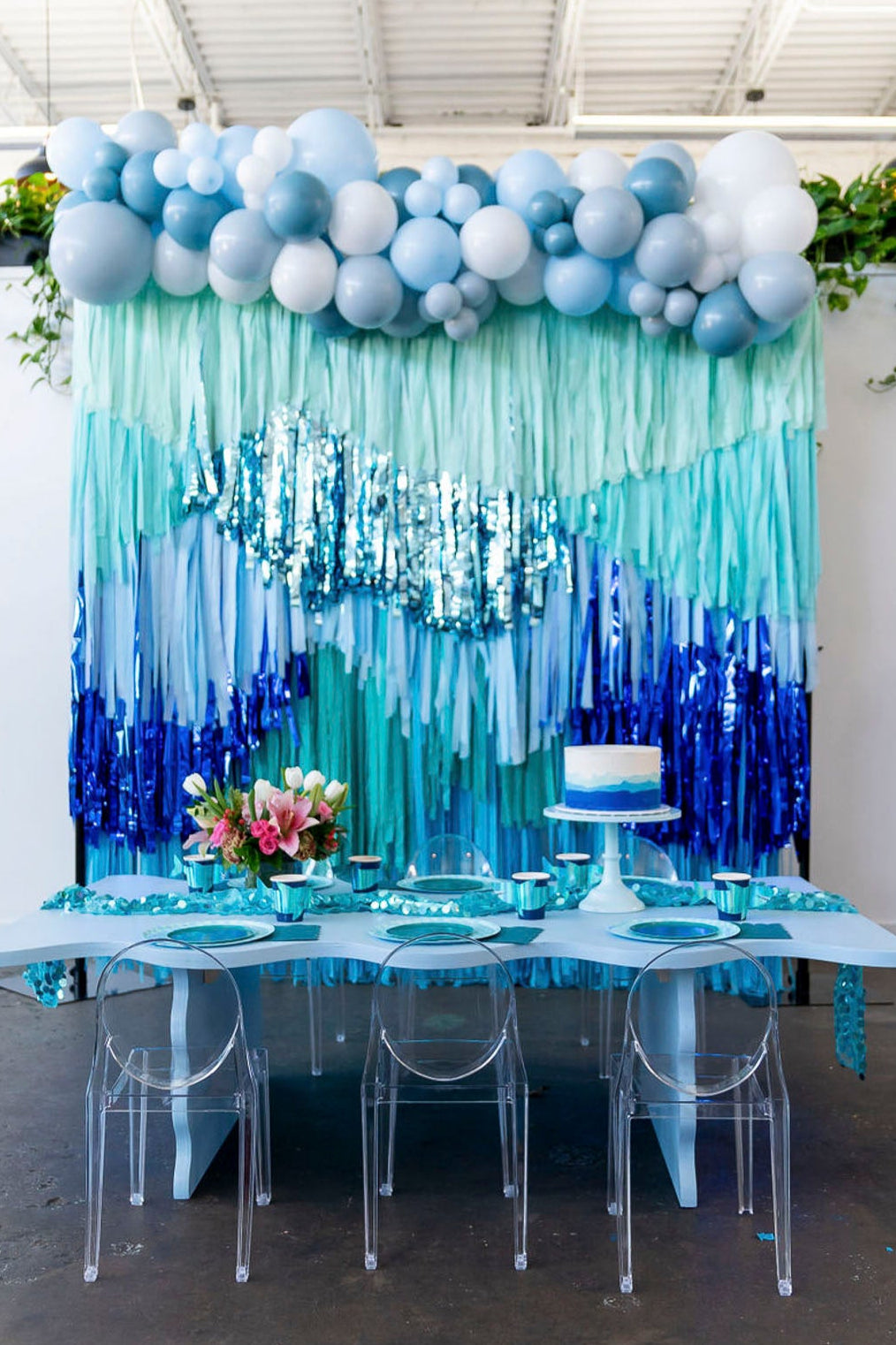 Blue underwater themed fringe backdrop and balloon garland by Oh My Darling Party Co